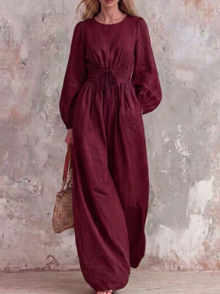 Burgundy wide leg jumpsuit with long balloon sleeves, full length front view