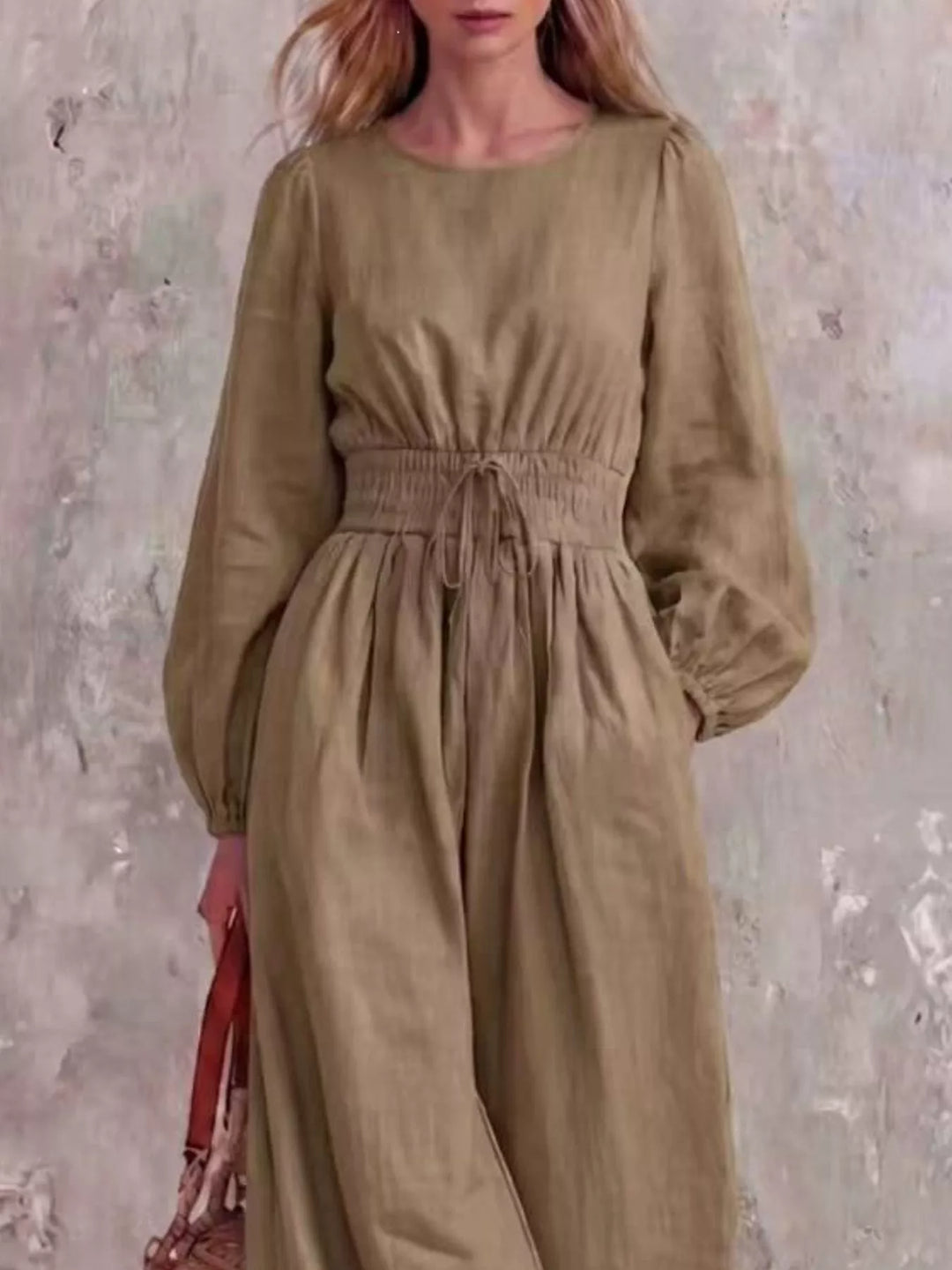 Khaki jumpsuit with cinched waist and round neckline, closer front view