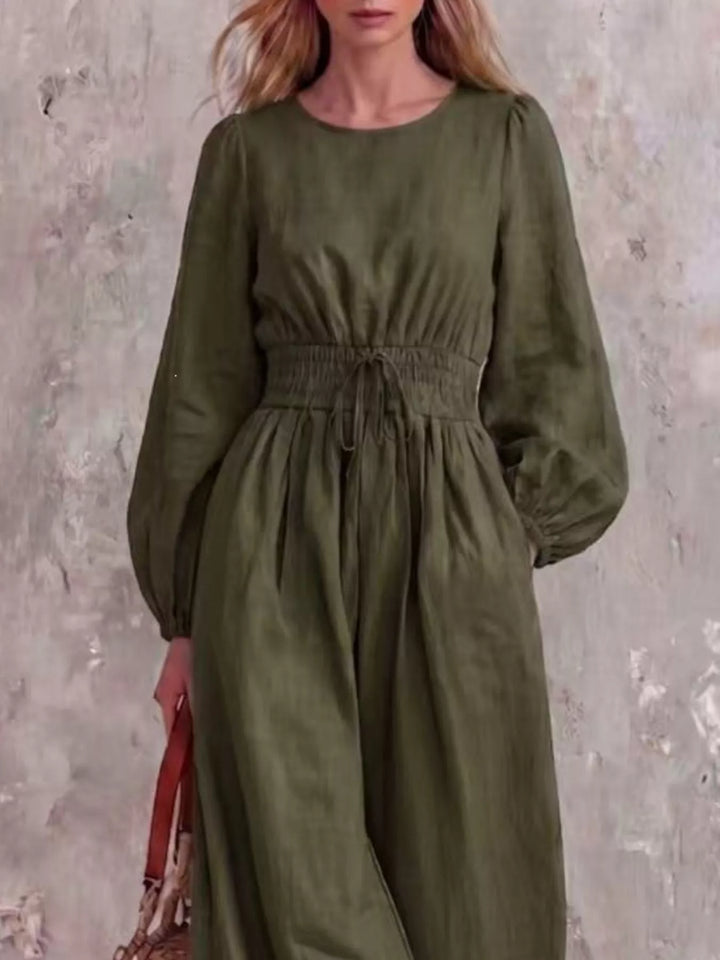 Olive jumpsuit with cinched waist and round neckline, closer front view