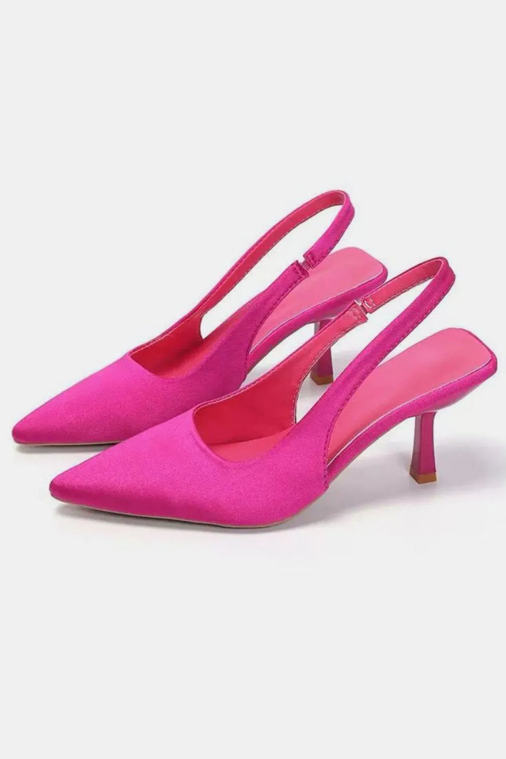 Fuchsia pink slingback kitten heels with a pointed toe, pair view