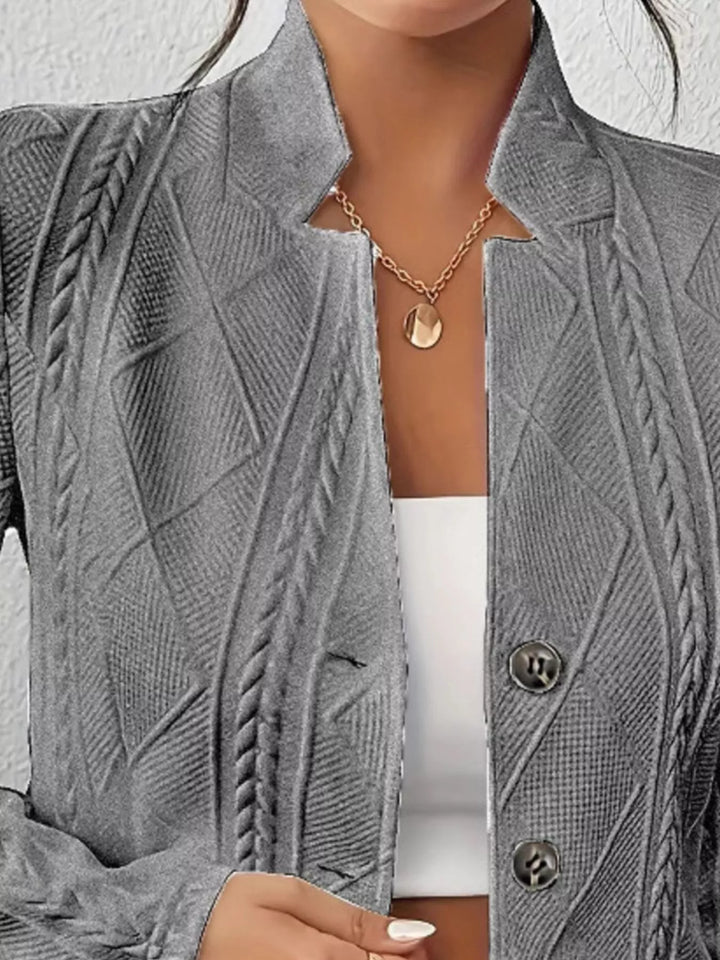 Close-up of the dark gray blazer stand collar and textured knit