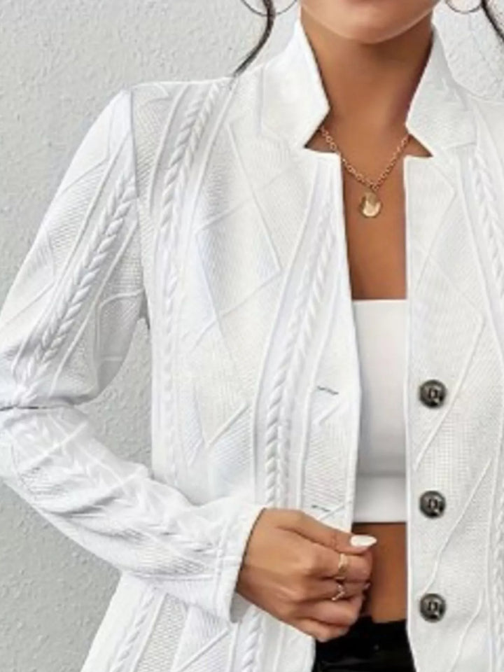 Detail of the white knit blazer stand collar and neckline