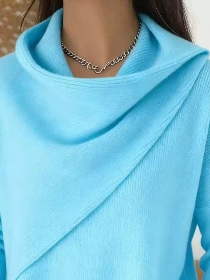 Draped diagonal cowl neck ribbed hem in sky blue, close-up detail