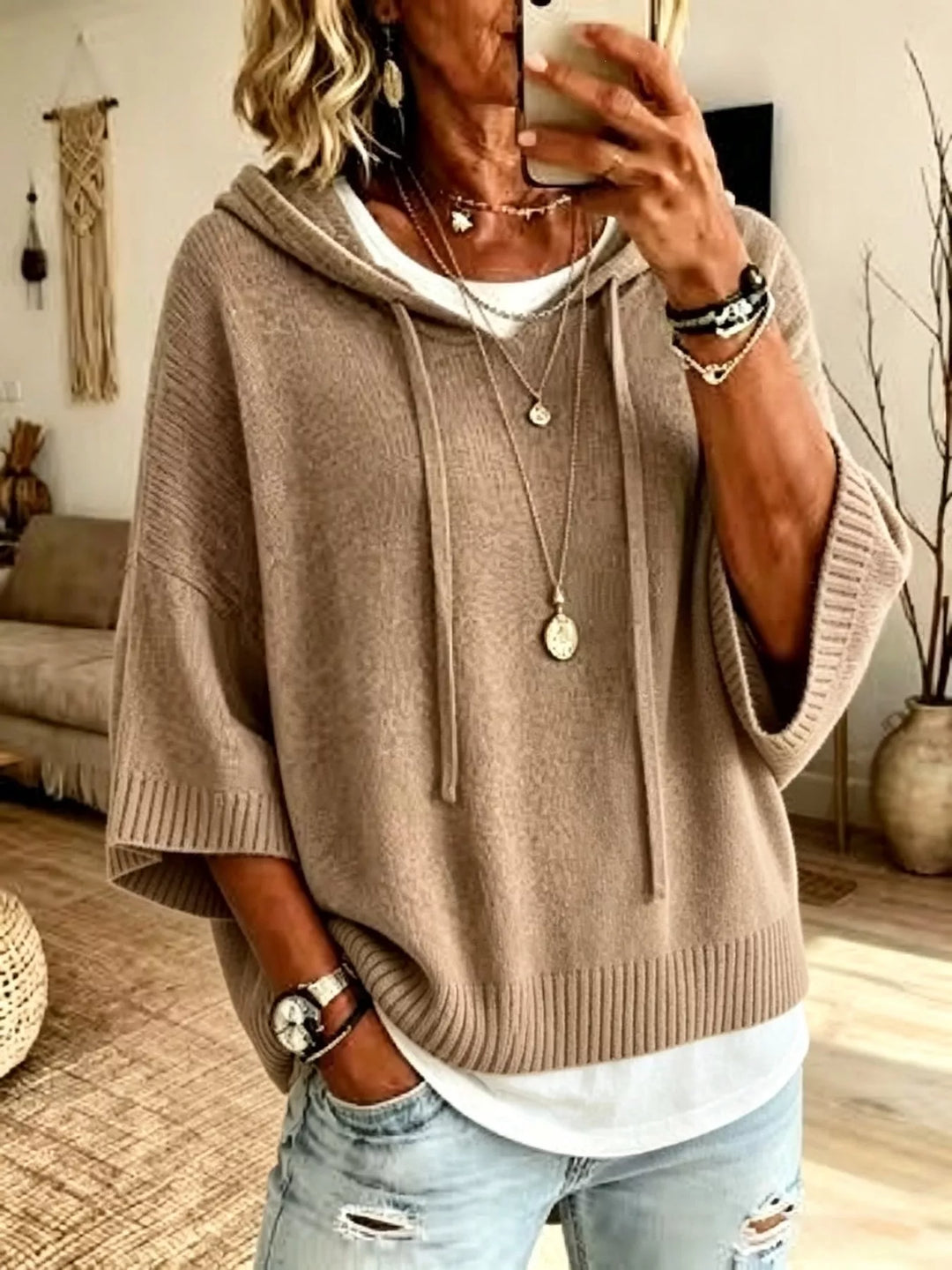 Taupe hooded knit sweater with batwing sleeves and drawstrings, front view