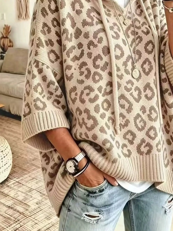 Hooded leopard print poncho style in apricot, close-up detail