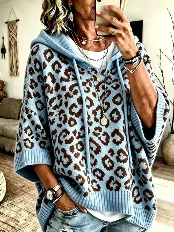 Hooded leopard print poncho style in blue, front view
