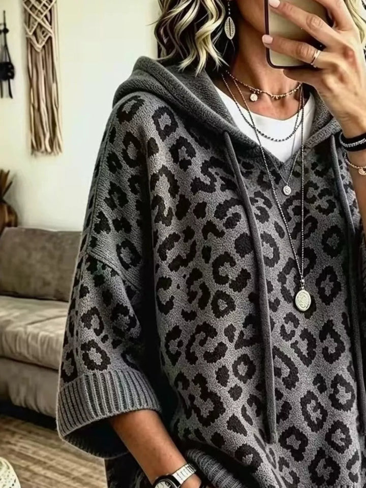 Hooded leopard print poncho style in dark gray, close-up detail