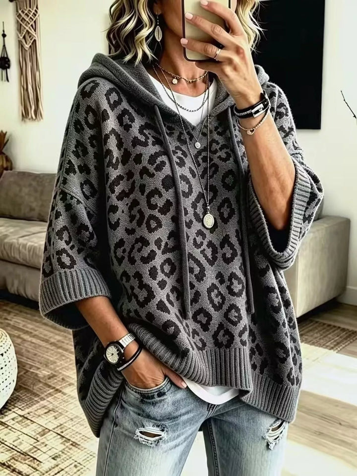 Hooded leopard print poncho style in dark gray, front view