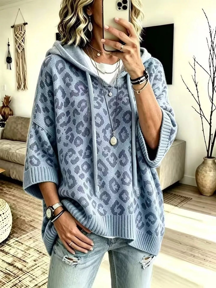 Hooded leopard print poncho style in dusty blue, front view
