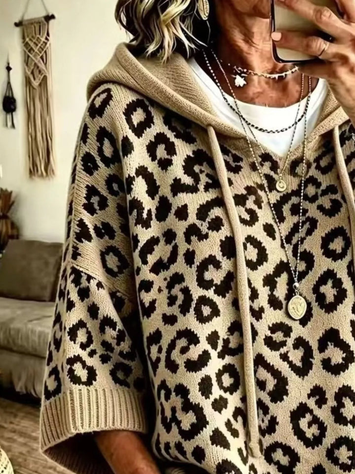 Hooded leopard print poncho style in khaki, close-up detail