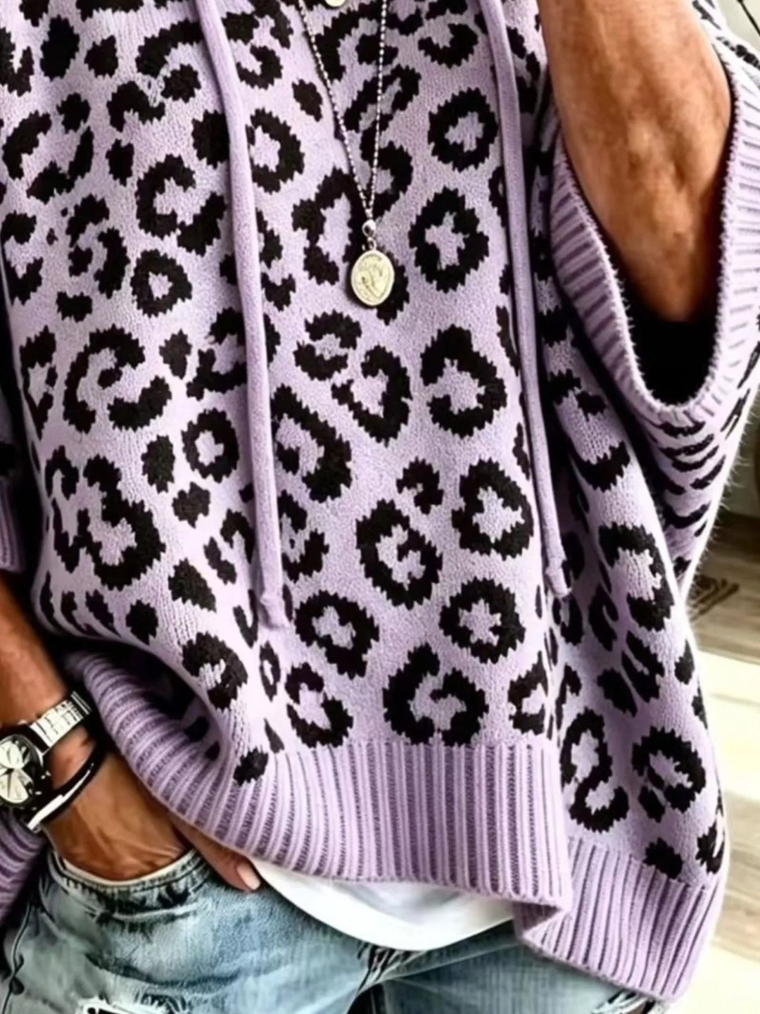 Hooded leopard print poncho style in purple, close-up detail