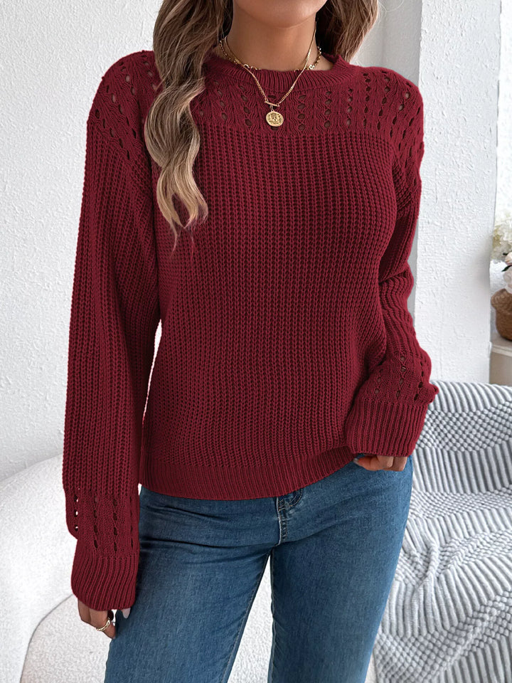 Closer front view of the burgundy sweater with cutout yoke and ribbed knit