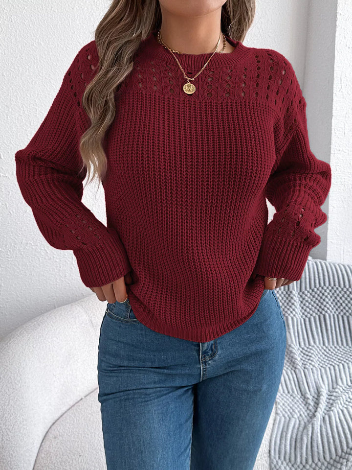 Women's burgundy knit sweater with round neck and openwork yoke, front view with jeans