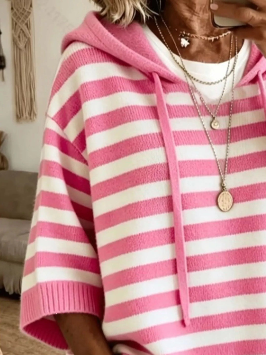 Striped hooded elbow length sleeves in gold, close-up detail
