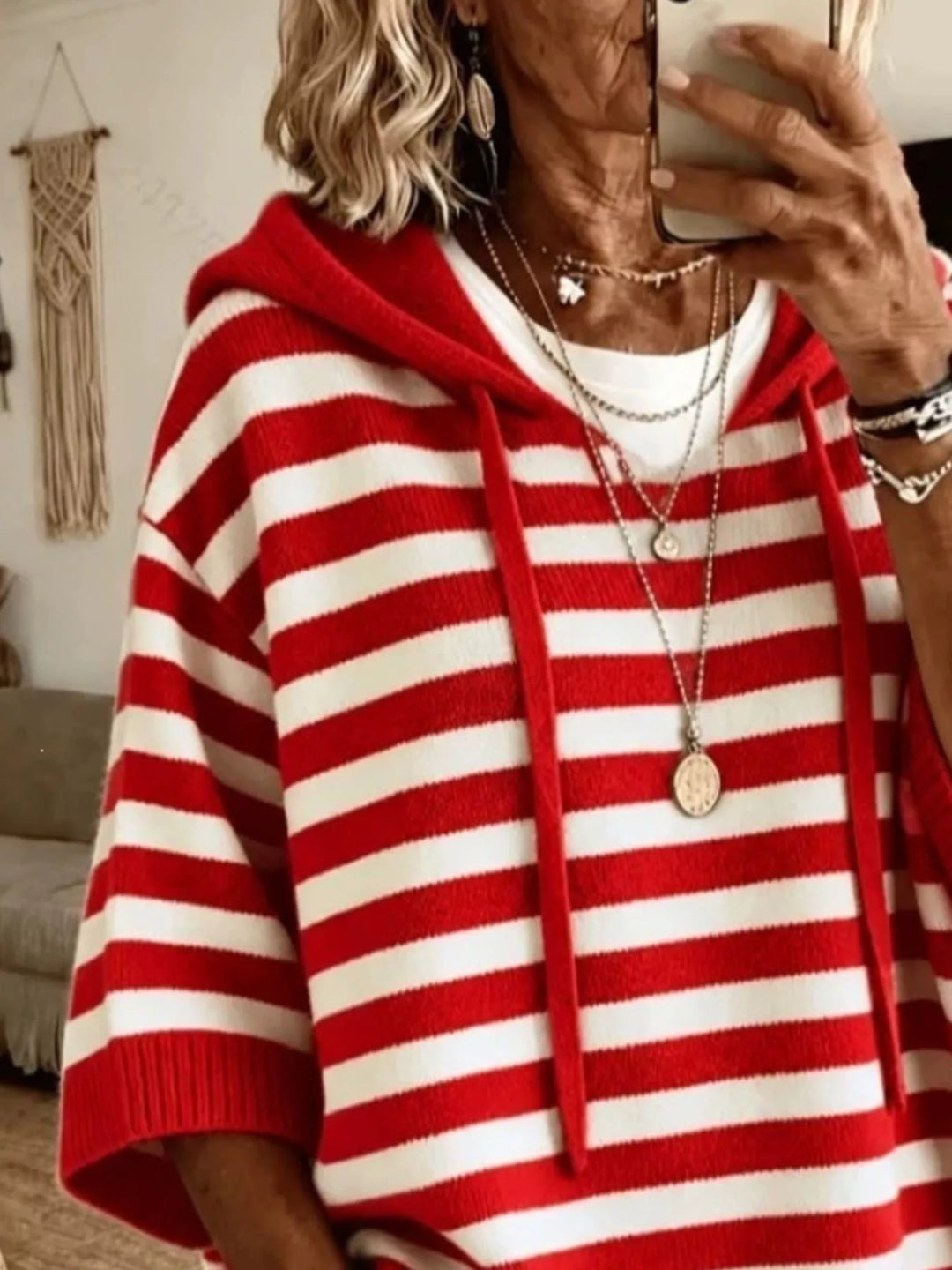 Striped hooded elbow length sleeves in red, close-up detail