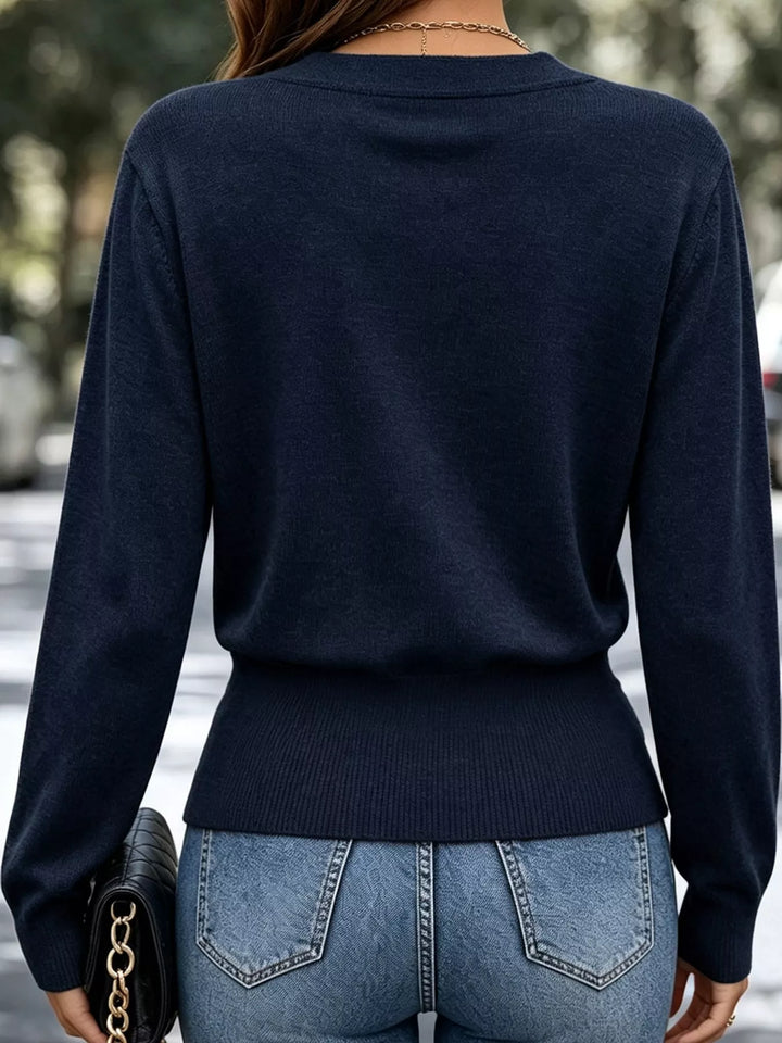 Surplice wrap front buckle belted waist in navy, back view