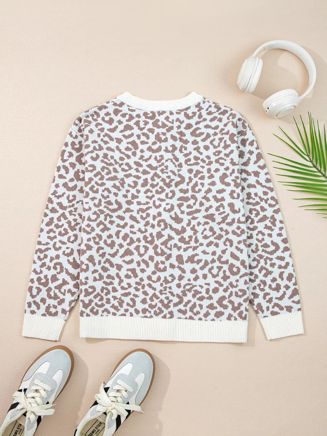 Flat view of the ivory leopard cardigan, back with round neck
