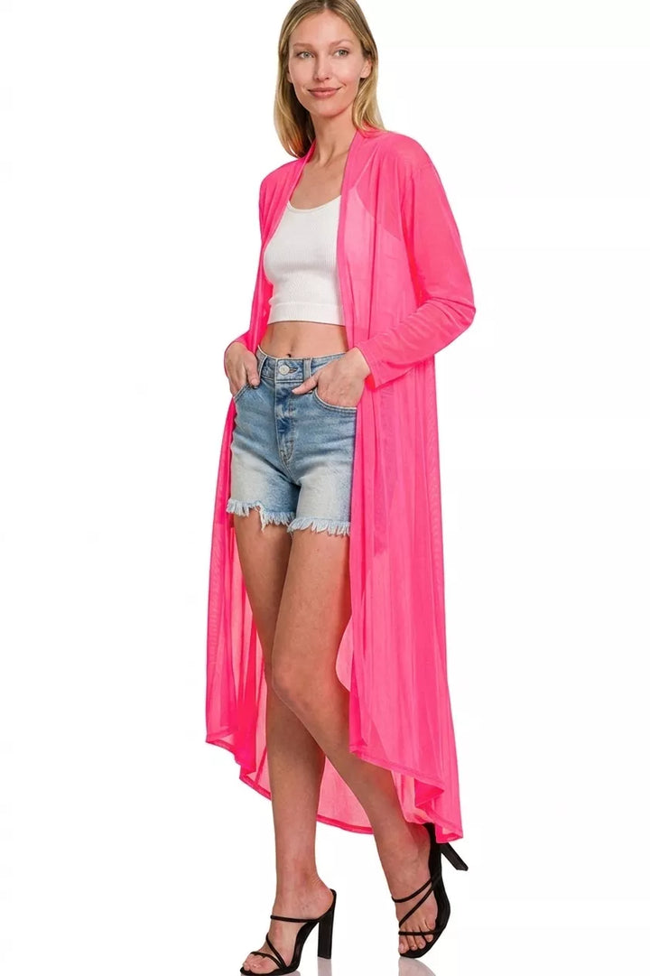 Hot pink sheer duster cardigan with denim shorts and black heels