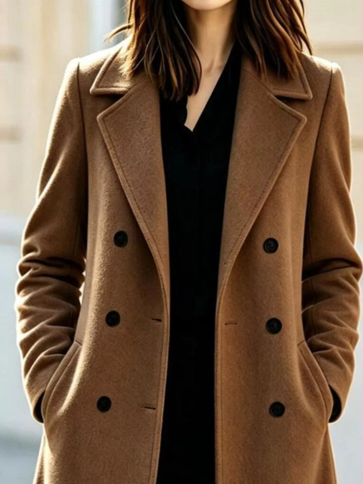 Close-up of the camel double breasted coat buttons and notch lapel