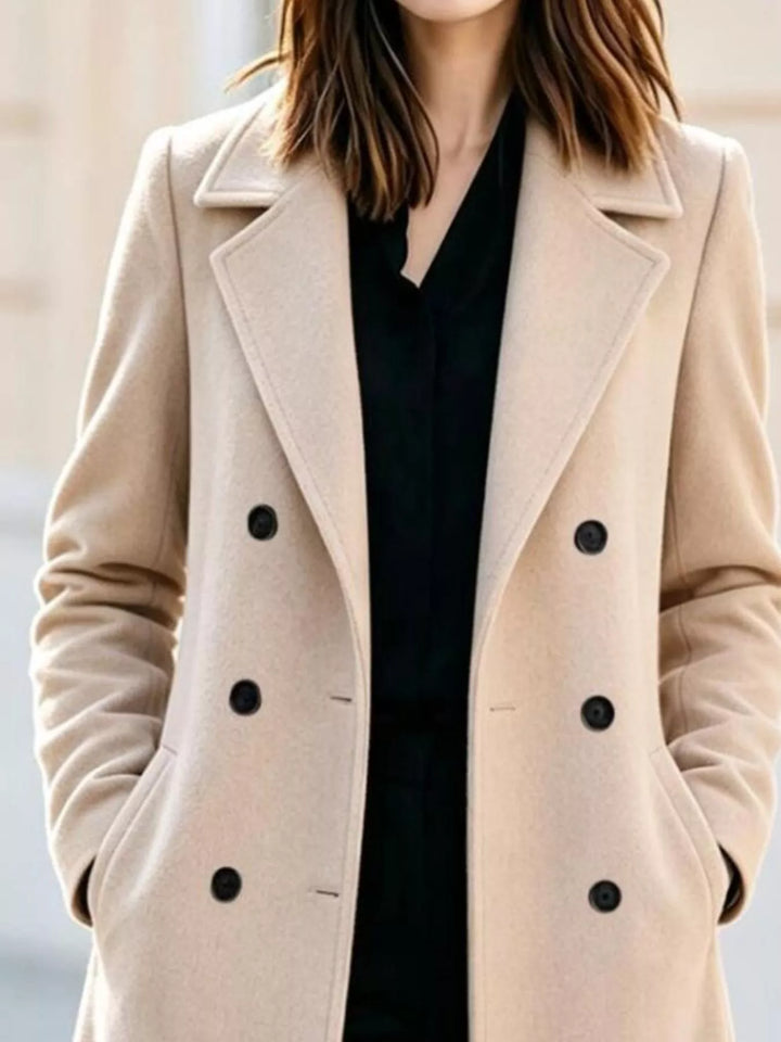 Close-up of the cream double breasted buttons and notch lapel