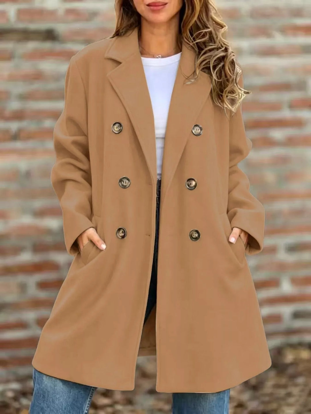 Camel double breasted long coat styled with a white tee and jeans