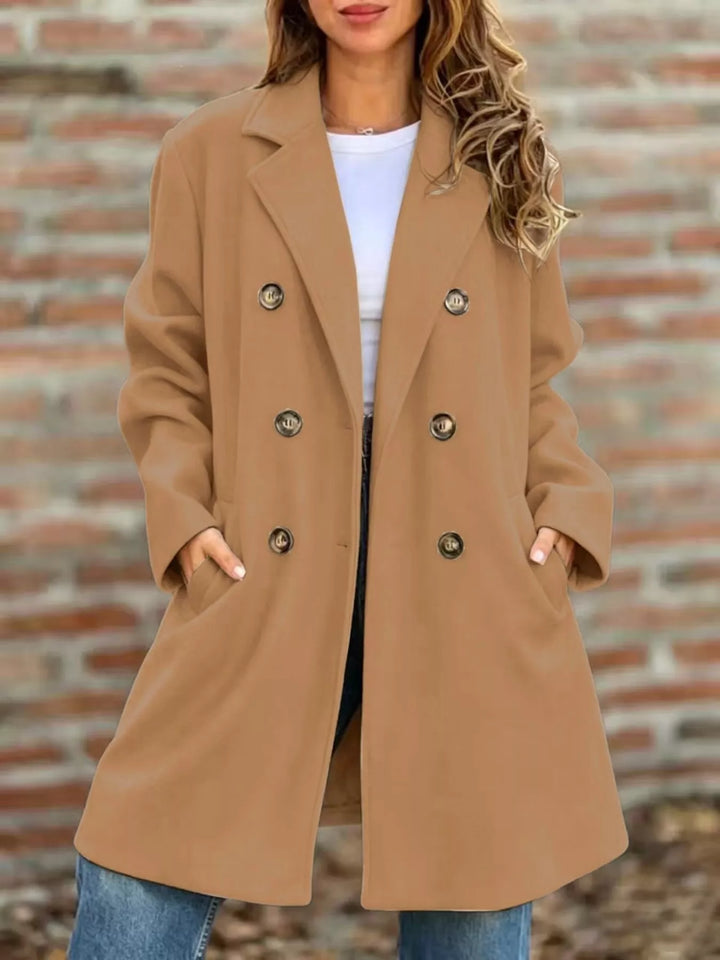 Camel double breasted long coat styled with a white tee and jeans
