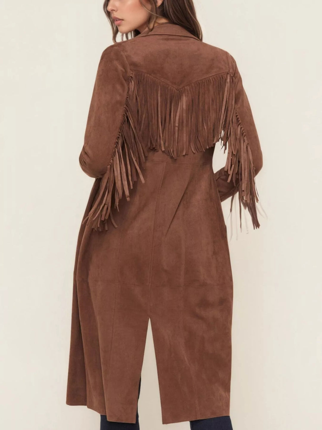 Back view of the cognac duster coat with fringe across the shoulders and back slit
