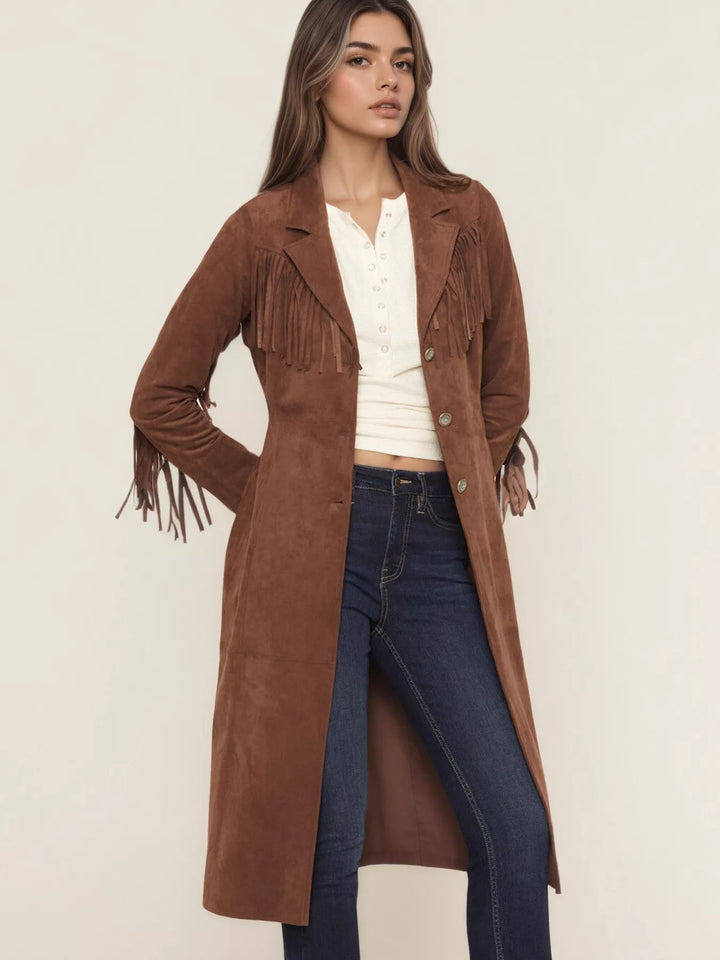 Full length cognac fringe duster styled with dark skinny jeans and fringed sleeves
