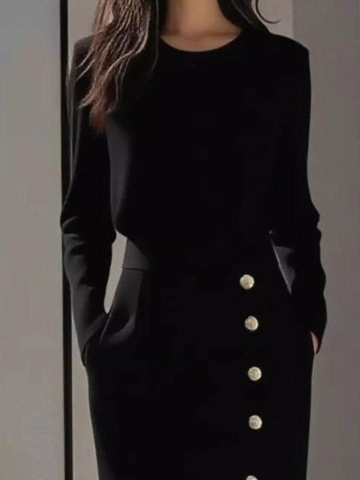 Round neck side button slit pockets in black, close-up detail