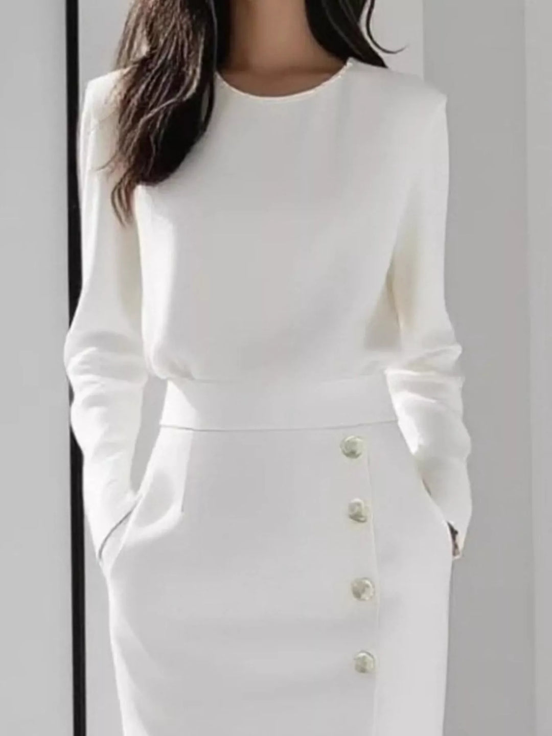 Round neck side button slit pockets in white, close-up detail
