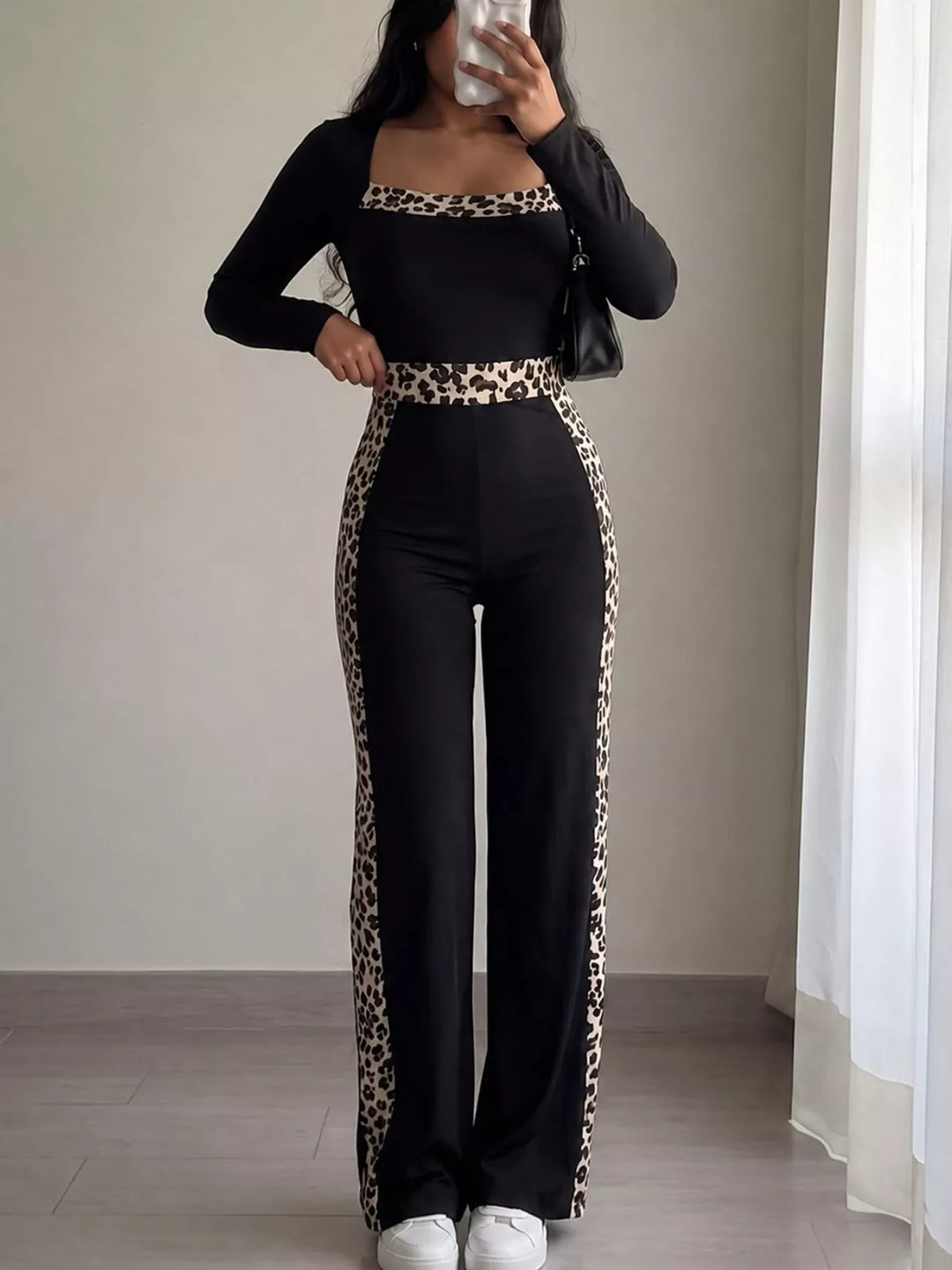 Women's long sleeve jumpsuit in black, leopard trim square neck keyhole back
