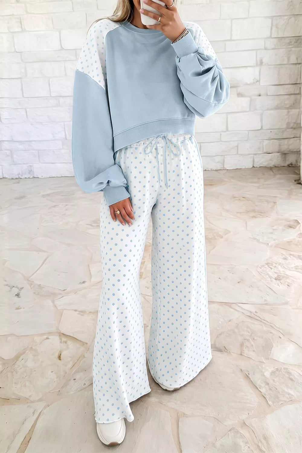 Light blue cropped sweatshirt with polka dot lounge pants, front view