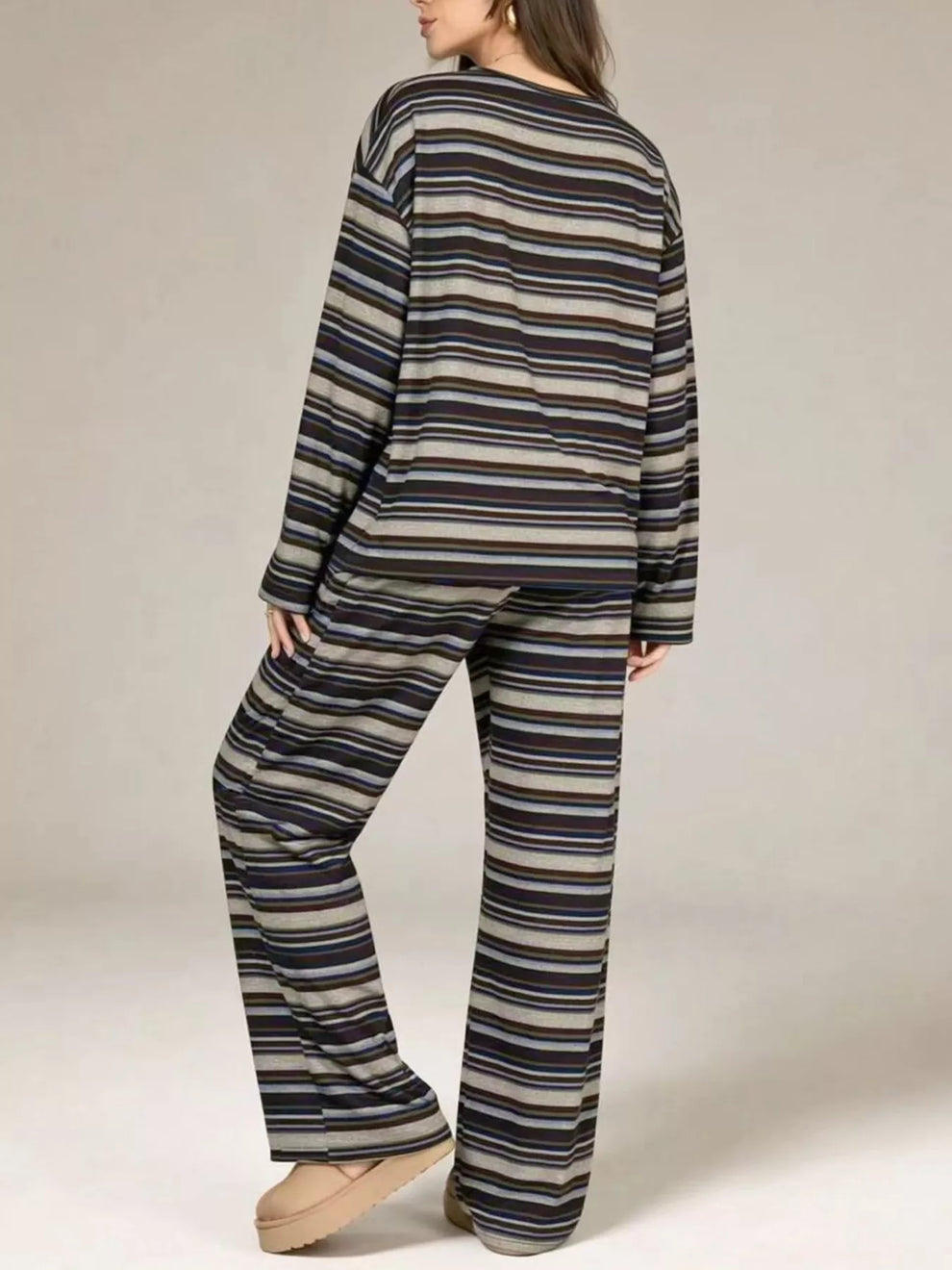 Charcoal striped lounge set seen from behind with relaxed fit pants