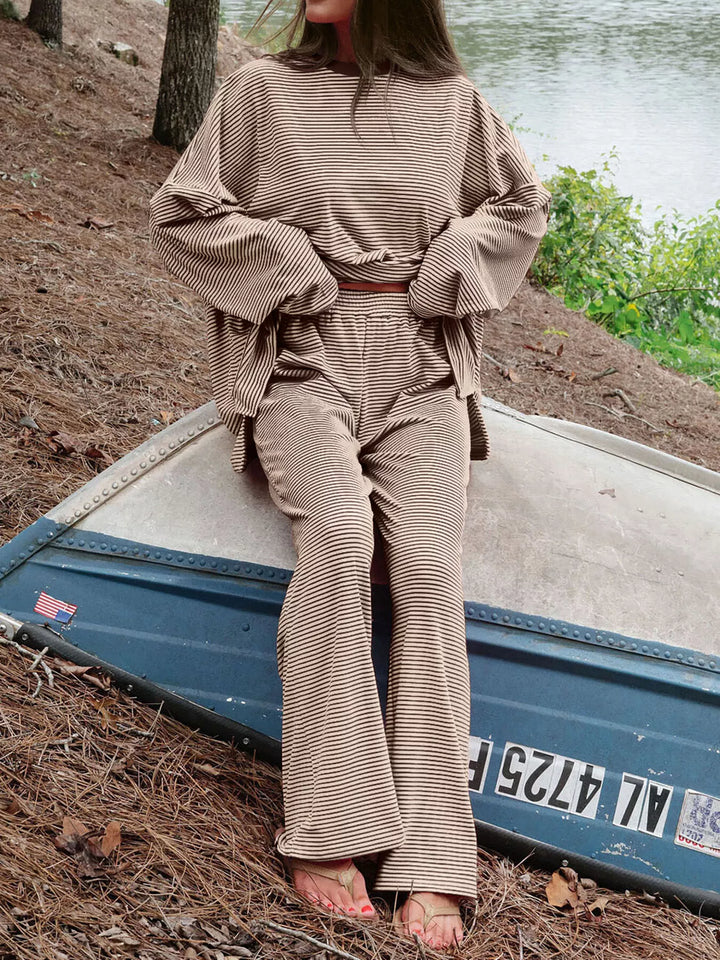 Mocha lounge set worn seated on a boat near the shore