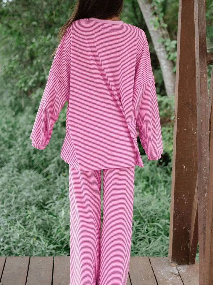 Back view of the pink oversized top and wide leg pants