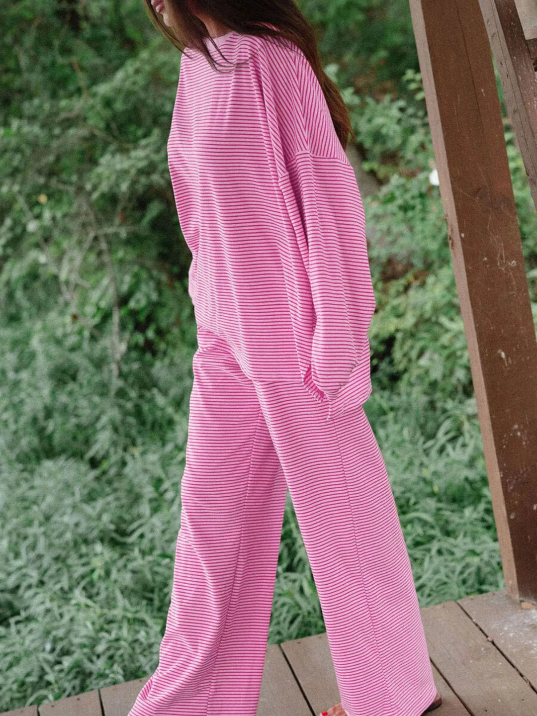 Side view of the pink lounge set with a side slit top