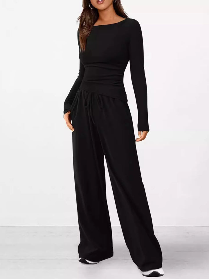 Full-length black lounge set with ruched long sleeve top and wide leg pants