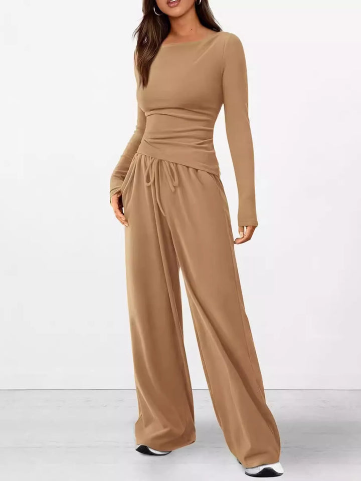 Full-length camel lounge set in a relaxed standing pose with white sneakers