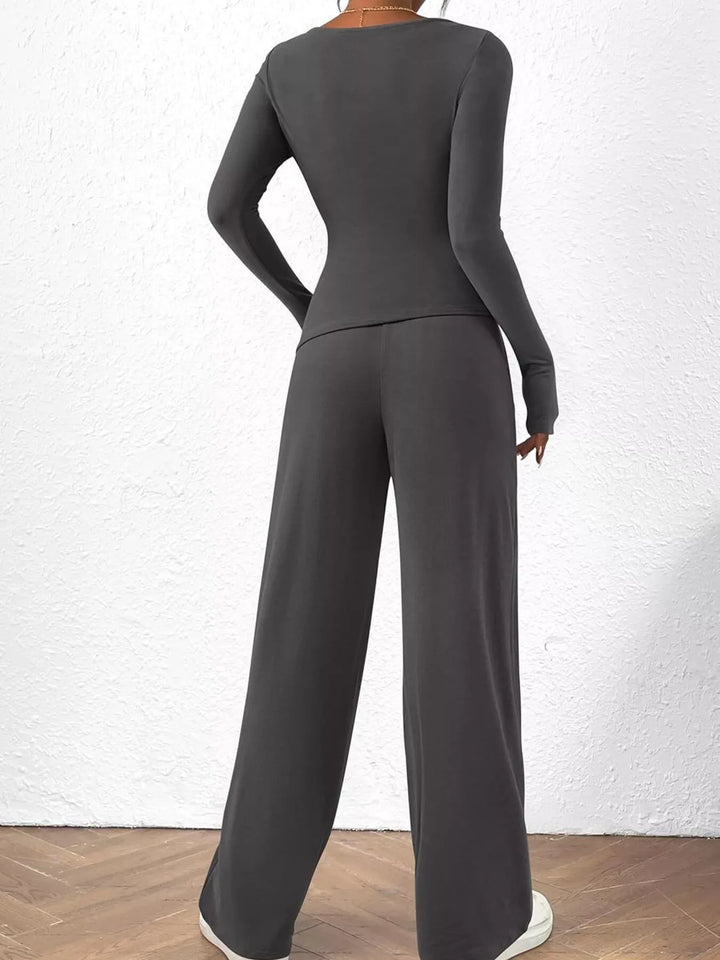 Charcoal ruched long sleeve top and wide leg pants from behind