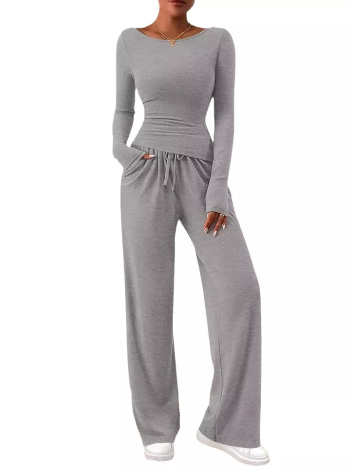 Full-length light gray lounge set on a plain white background