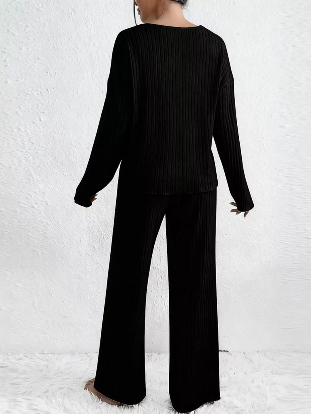 Back view of the black ribbed v neck top and wide leg pants