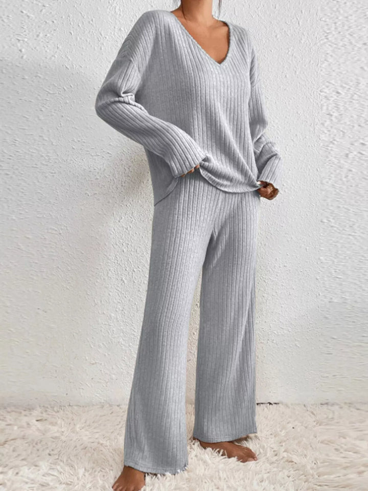 Gray v neck ribbed top and wide leg pants, angled stance
