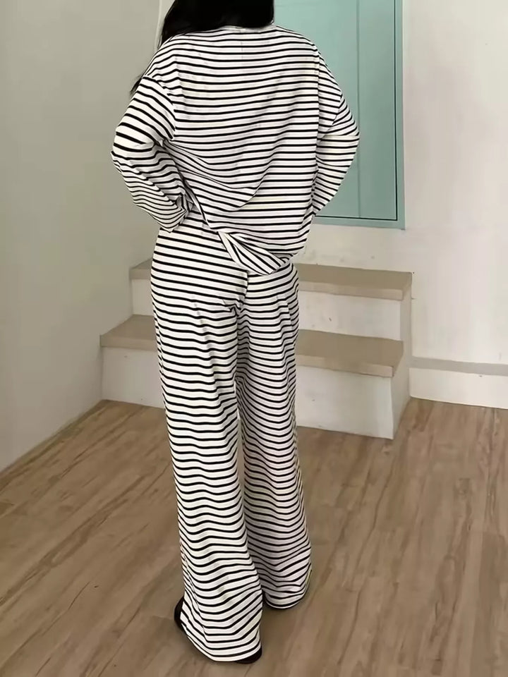 Back view of the black striped lounge set top and pants