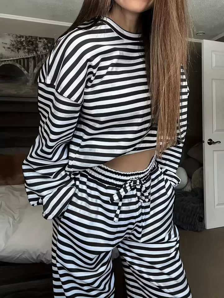 Black striped lounge set with a long sleeve top and drawstring pants, front view