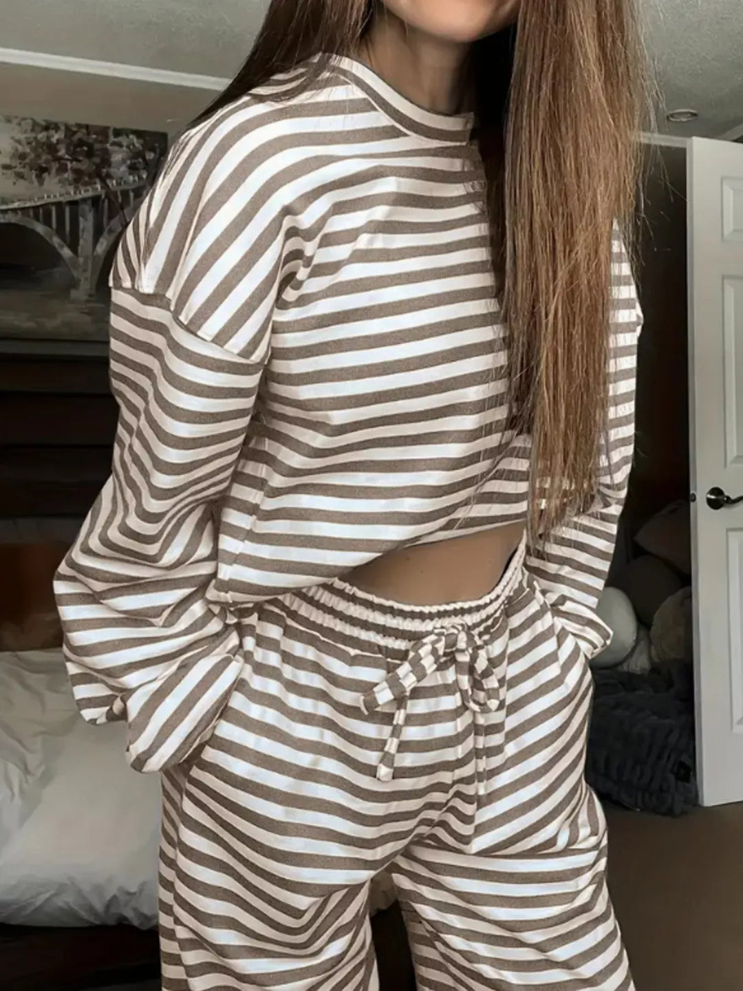 Taupe striped lounge set worn with a hand in the pocket, front view