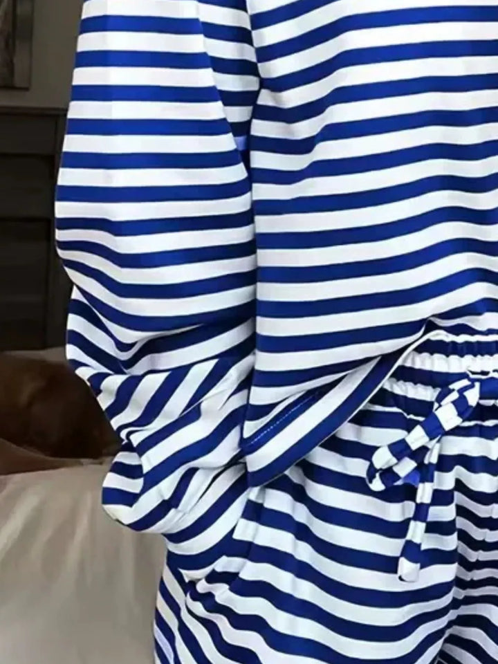 Close-up of the cobalt striped sleeve and tie waist of the lounge set