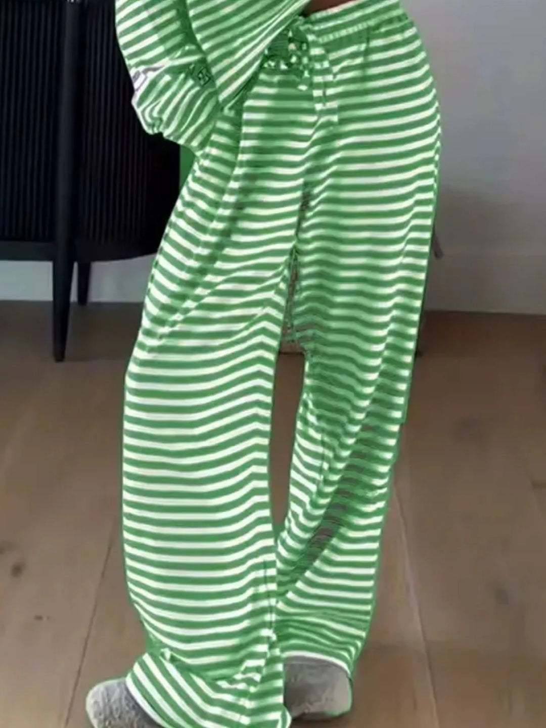 Close-up of the green striped wide leg pants with drawstring waist