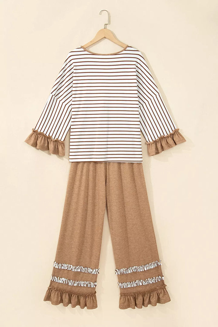 Back view of the striped lounge top and camel wide leg pants on hangers