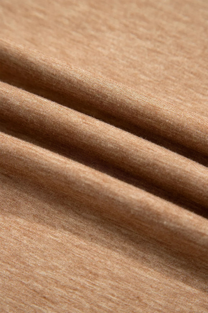 Soft folds of the camel lounge set fabric in a close-up