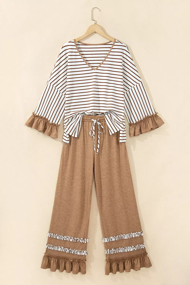 Striped V neck top and camel wide leg pants hanging together, front view